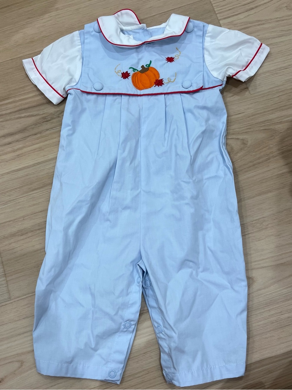 Petit Ami Light Blue Romper with Pumpkin Embroidery and Red Trim
